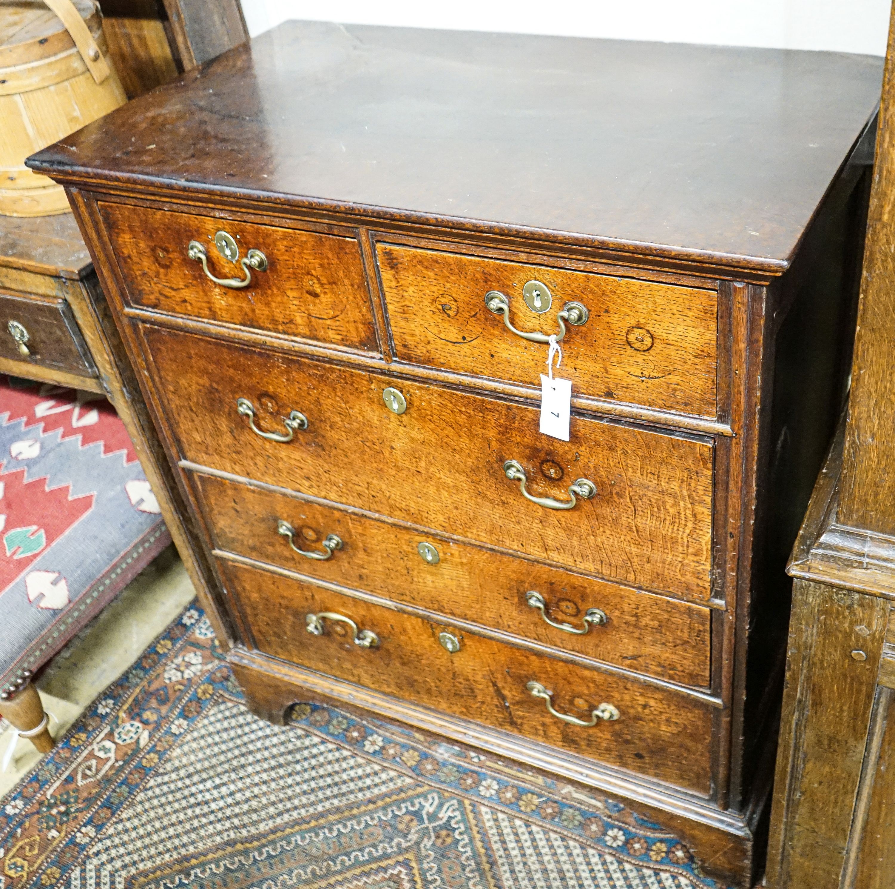 A George III oak chest of five drawers, on bracket feet, width 90cm, depth 52cm, height 103cm